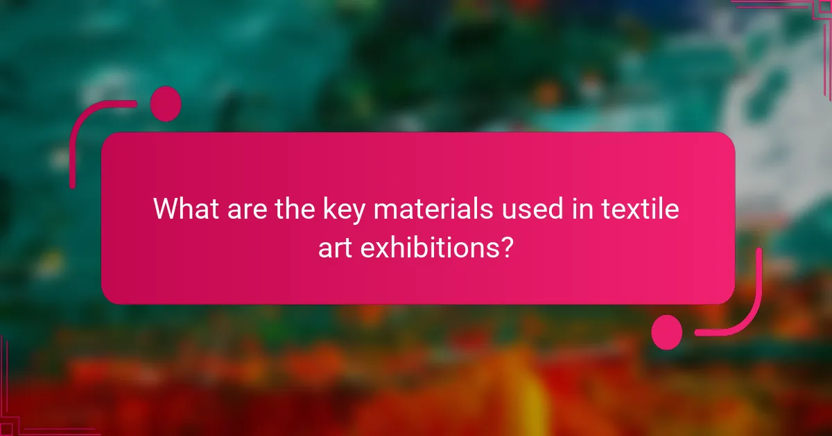 What are the key materials used in textile art exhibitions?